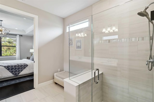 bathroom featuring a stall shower, baseboards, ensuite bathroom, tile patterned flooring, and a notable chandelier