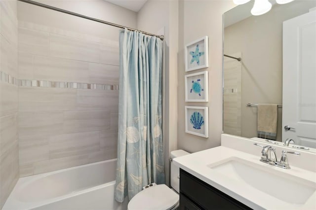 bathroom with vanity, shower / bath combination with curtain, and toilet