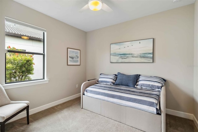 bedroom with carpet, a ceiling fan, and baseboards