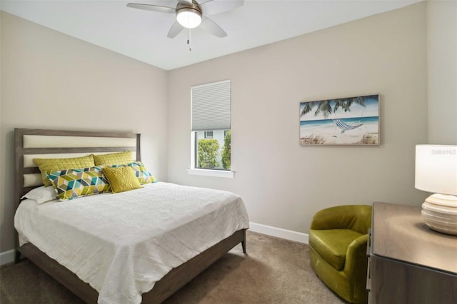 bedroom with ceiling fan, carpet flooring, and baseboards