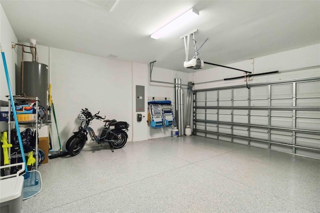 garage featuring a garage door opener, electric panel, and water heater