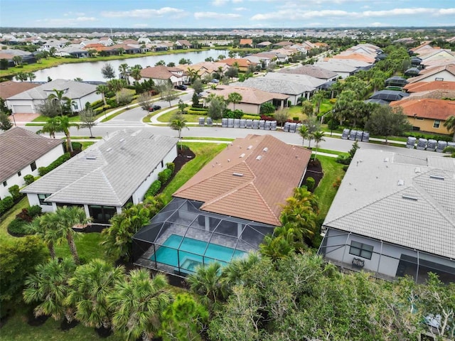 aerial view featuring a water view and a residential view