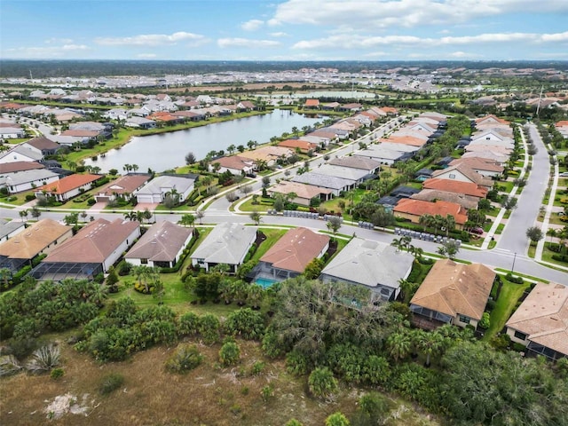 aerial view with a residential view and a water view