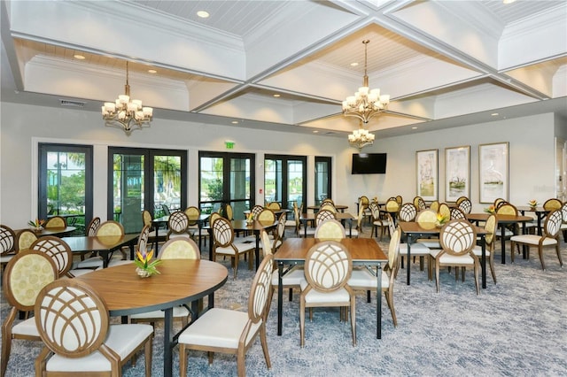 dining room featuring visible vents, coffered ceiling, an inviting chandelier, crown molding, and a healthy amount of sunlight