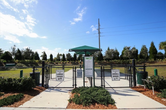 view of gate with fence