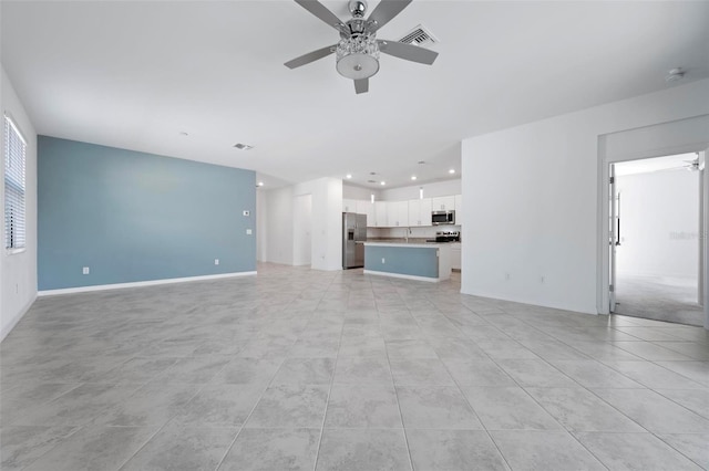 unfurnished living room with visible vents, recessed lighting, light tile patterned floors, baseboards, and ceiling fan