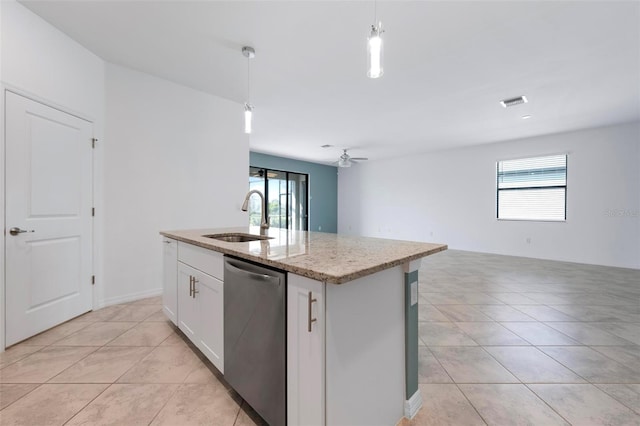 kitchen featuring open floor plan, dishwasher, an island with sink, hanging light fixtures, and a sink