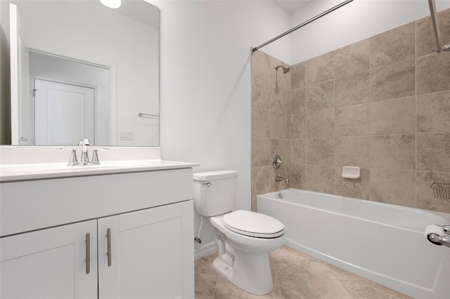 full bath with vanity,  shower combination, toilet, and tile patterned floors