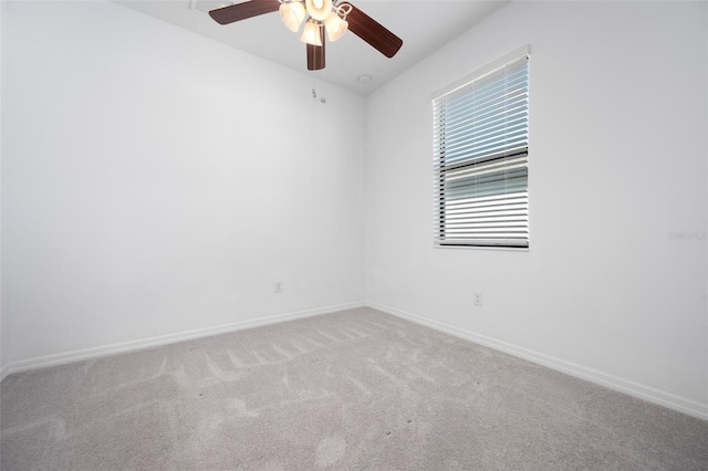 unfurnished room featuring carpet flooring, baseboards, and ceiling fan