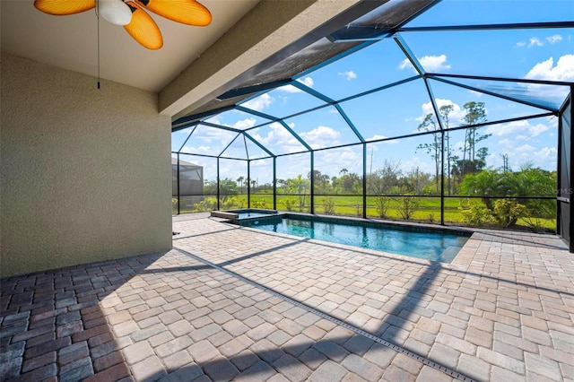 view of swimming pool with a ceiling fan, a lanai, a patio area, and a pool with connected hot tub