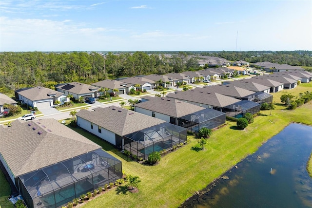 birds eye view of property with a residential view and a water view