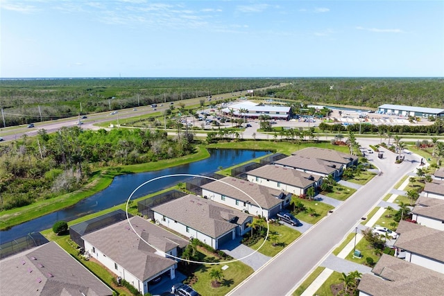 bird's eye view with a residential view and a water view