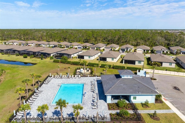 aerial view with a residential view and a water view