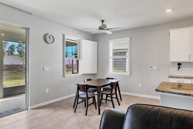 dining area featuring light tile patterned floors, recessed lighting, a ceiling fan, and baseboards