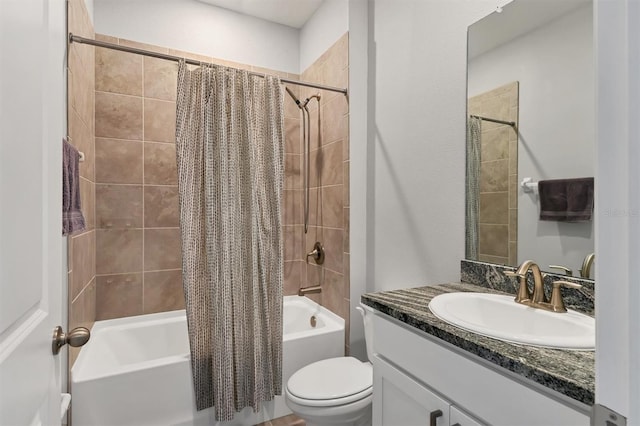 full bath with vanity, shower / bath combo with shower curtain, and toilet