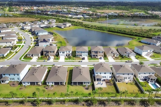 aerial view featuring a residential view and a water view