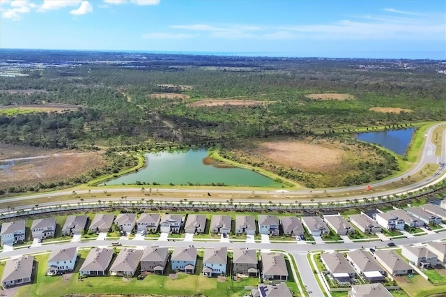 bird's eye view with a water view and a residential view