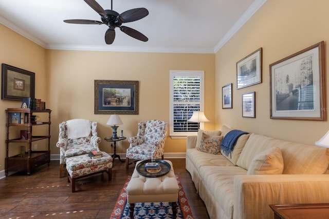 living area with ceiling fan, dark wood-style floors, baseboards, and ornamental molding