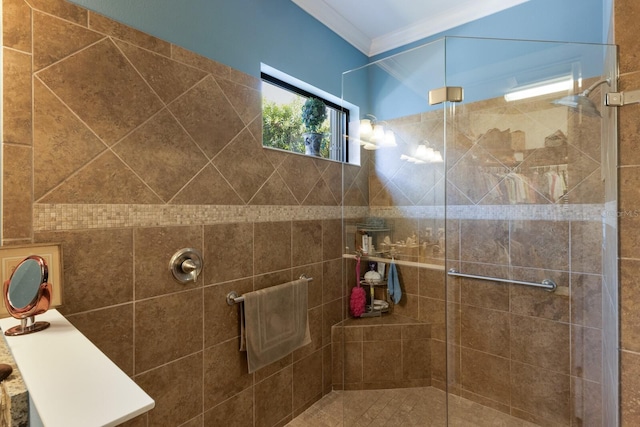 full bathroom featuring crown molding and tiled shower