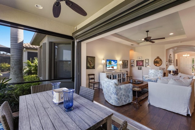 interior space with outdoor dining space and ceiling fan