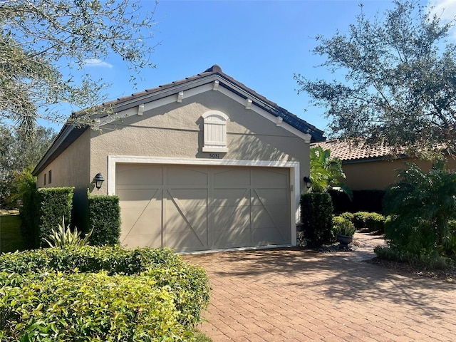 5031 Serata Dr, Bradenton, FL 34211 - garage featuring decorative driveway