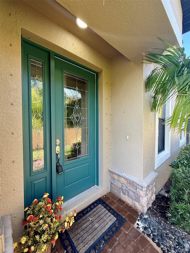 5031 Serata Dr, Bradenton, FL 34211 - view of exterior entry with stone siding and stucco siding