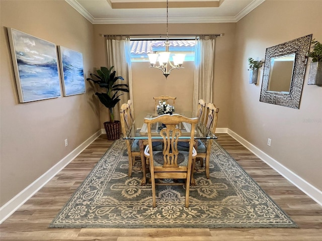 5031 Serata Dr, Bradenton, FL 34211 - dining room with baseboards, ornamental molding, and wood finished floors