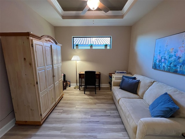 5031 Serata Dr, Bradenton, FL 34211 - living room with light wood finished floors, baseboards, a raised ceiling, ceiling fan, and crown molding