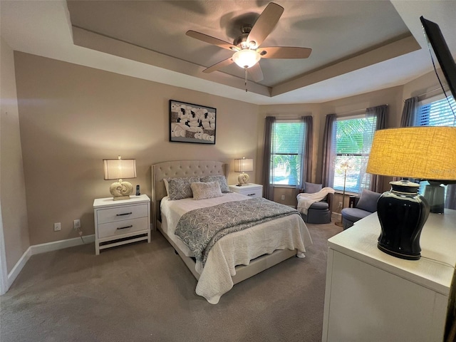 5031 Serata Dr, Bradenton, FL 34211 - carpeted bedroom featuring ceiling fan, baseboards, and a raised ceiling