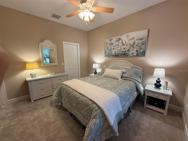 5031 Serata Dr, Bradenton, FL 34211 - bedroom with carpet floors, baseboards, visible vents, and ceiling fan