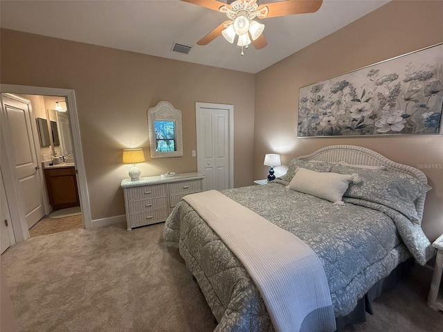 5031 Serata Dr, Bradenton, FL 34211 - bedroom with carpet floors, a closet, visible vents, ceiling fan, and a sink