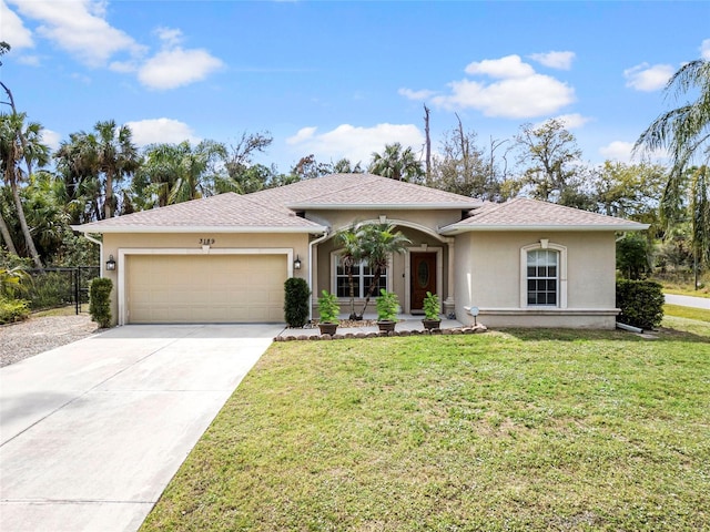 single story home with a garage, a front lawn, concrete driveway, and stucco siding