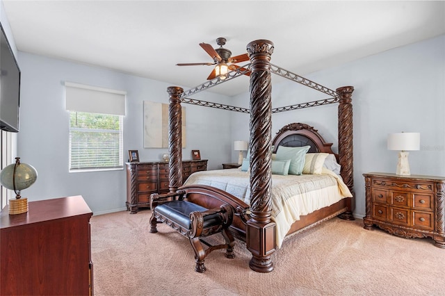 bedroom with baseboards, a ceiling fan, and light colored carpet