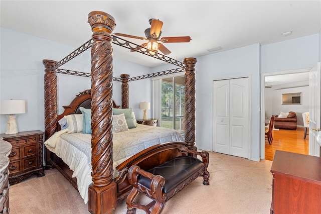 bedroom featuring light carpet, ceiling fan, a closet, and access to exterior