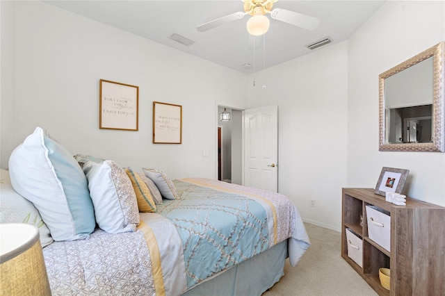 bedroom with carpet floors, visible vents, and a ceiling fan