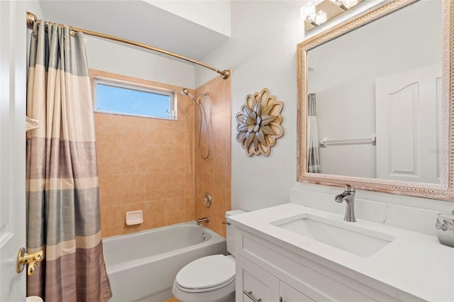 bathroom featuring toilet, shower / bath combo with shower curtain, and vanity