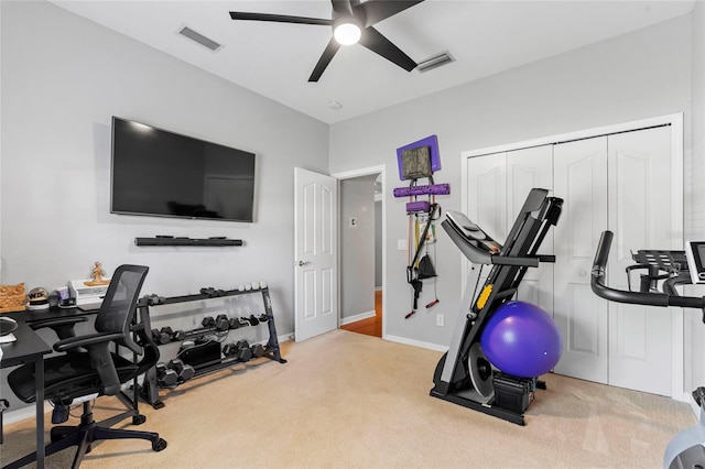 workout area featuring carpet, visible vents, and ceiling fan