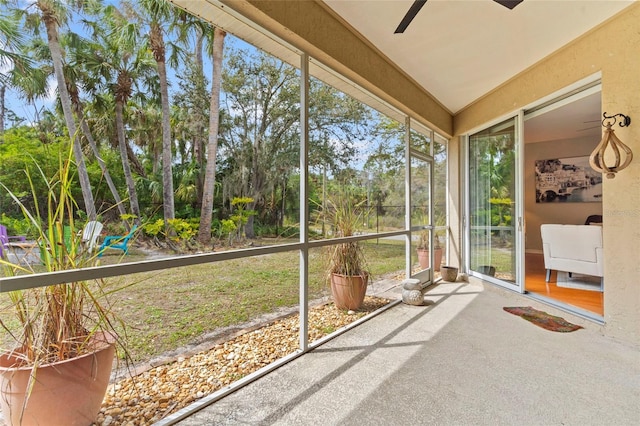 sunroom / solarium with ceiling fan