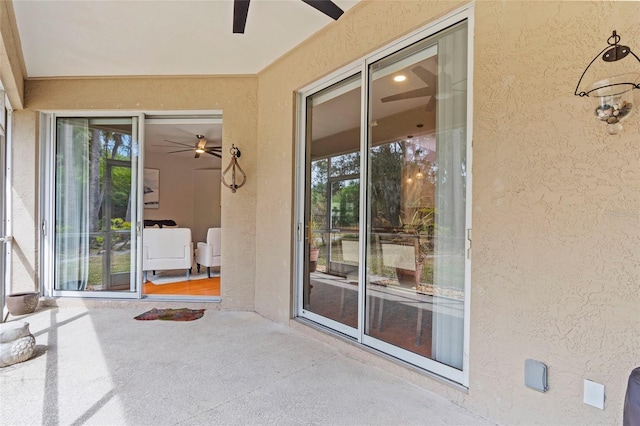 exterior space with a patio and stucco siding