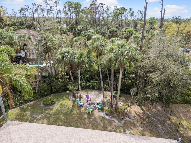 view of yard with a fire pit