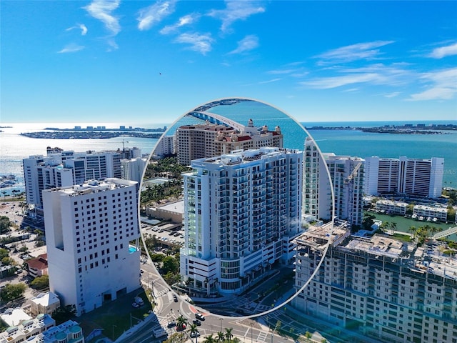 bird's eye view featuring a view of city and a water view