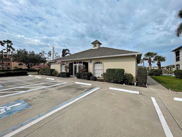 view of property featuring uncovered parking