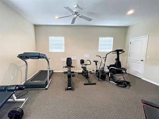 exercise room featuring a healthy amount of sunlight, baseboards, and a ceiling fan