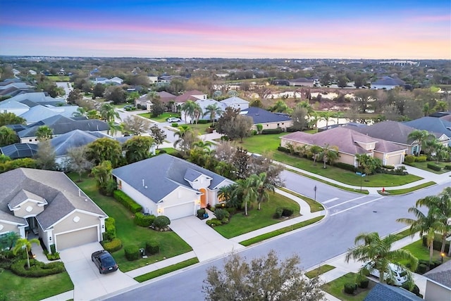 aerial view at dusk with a residential view