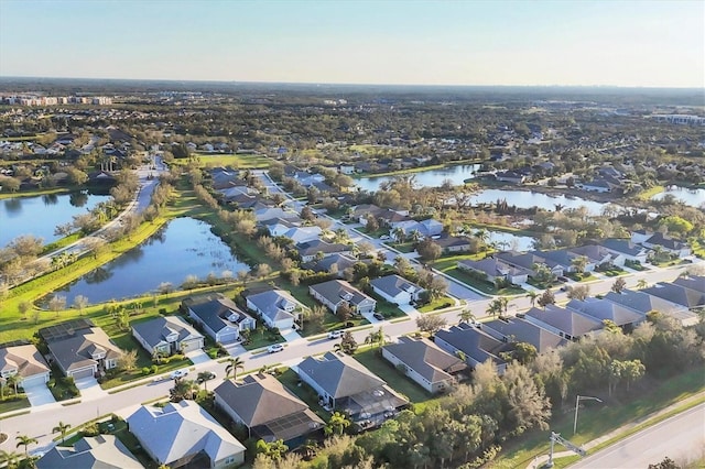 bird's eye view with a residential view and a water view