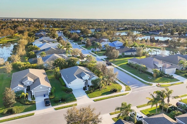 aerial view featuring a water view and a residential view