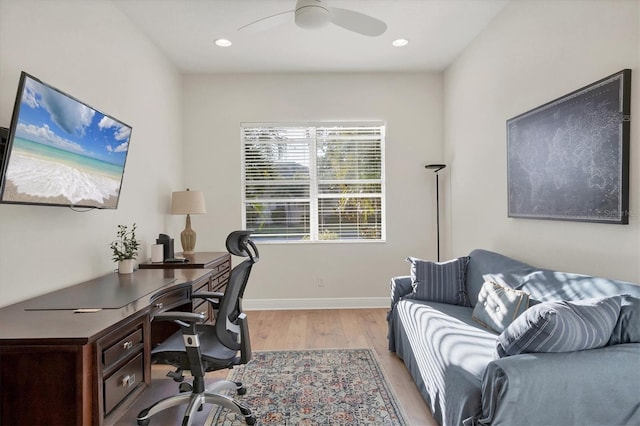 office space featuring baseboards, ceiling fan, recessed lighting, and light wood-style floors