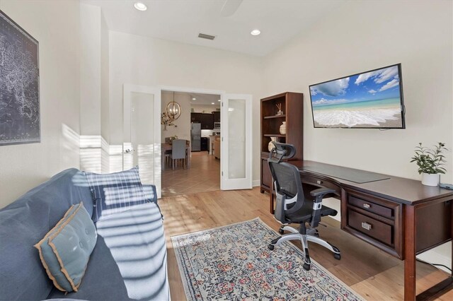 office area with recessed lighting, a notable chandelier, visible vents, french doors, and light wood finished floors