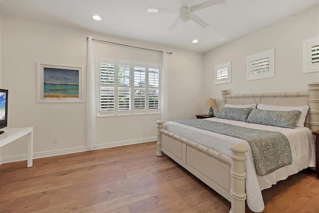 bedroom featuring recessed lighting, light wood-type flooring, and baseboards