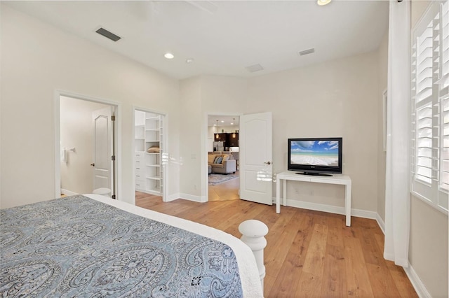 bedroom with recessed lighting, baseboards, visible vents, and light wood finished floors